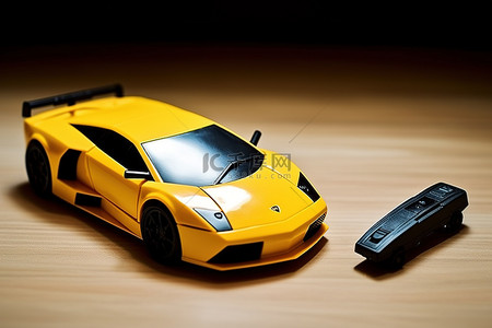 玩具背景图片_带遥控器的黄色玩具车模型