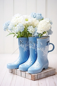鞋花背景图片_白蓝色橡胶靴和带花的软管
