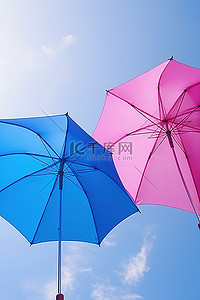 天空中有两把五颜六色的雨伞