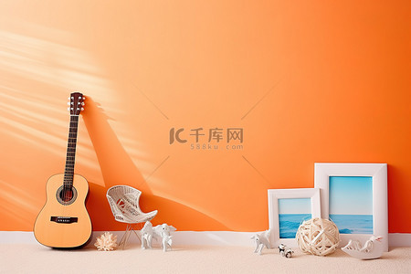 一幅画背景图片_房间里有一把吉他一个沙滩玩具和一幅画
