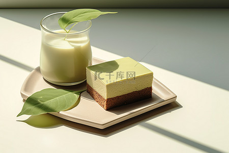 茶叶子背景图片_一个水罐，里面有一块蛋糕，旁边有叶子