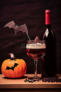 一个酒杯，上面有一只蝙蝠，旁边有纸杯蛋糕