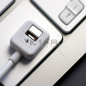 mac背景图片_连接到 Mac 键盘按钮的 USB 电缆