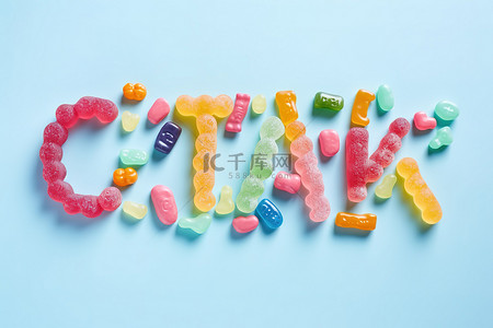 背景上的糖果字母，周围有各种小熊软糖