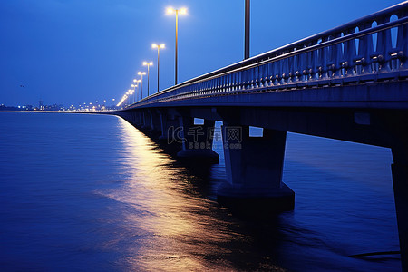 桥背景图片_越南西贡黄昏的海堤桥