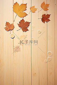 漂浮枫叶背景图片_秋叶漂浮在木桌和桌面上的空中