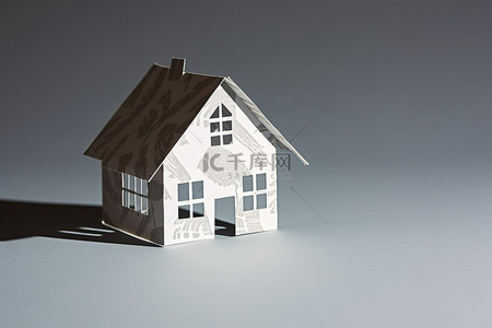房地产背景图片_灰色表面上的纸房子阴影