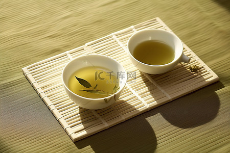 绿茶茶叶背景图片_垫子上绿茶的照片
