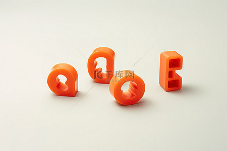 橙色字母背景图片_桌子顶部有三个橙色字母珠