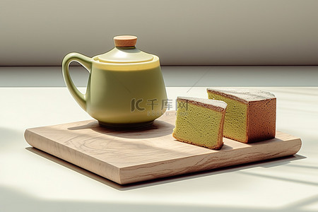 大理石桌上的壶蛋糕和绿茶