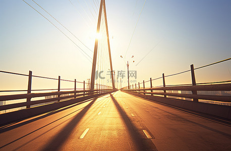 桥背景图片_一条路正穿过一座阳光下的桥