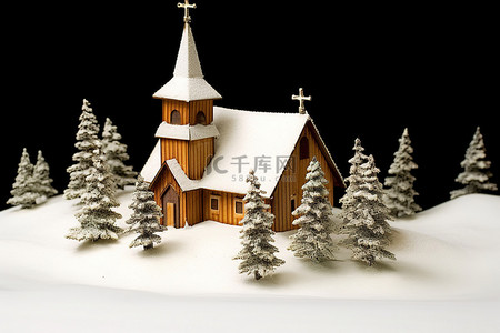 雪上一座小型模型教堂的冬季景观图像