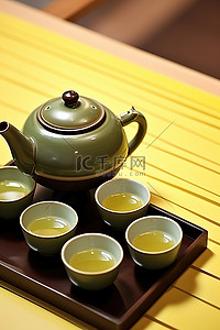 茶壶和小杯子围绕着碗
