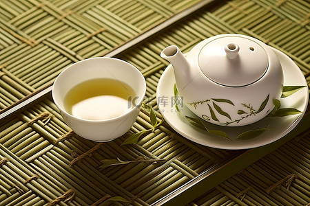 茶叶子背景图片_绿茶放在垫子上，垫子上有一片叶子