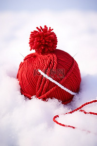 雪上上的脚印背景图片_雪上的红色和白色纱线