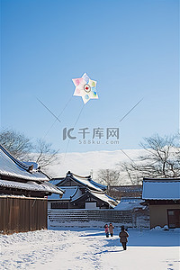 一群孩子在雪地里放风筝