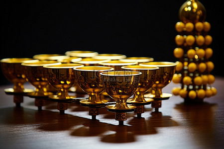 金杯背景图片_白桌上有算盘的金杯