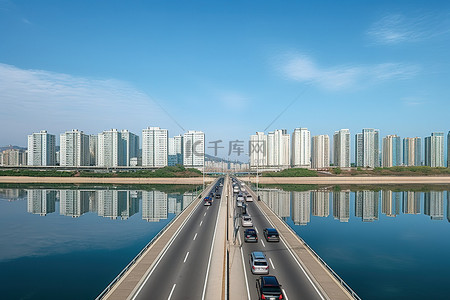 边境界碑背景图片_首尔边境湖上的两条高速公路和建筑物