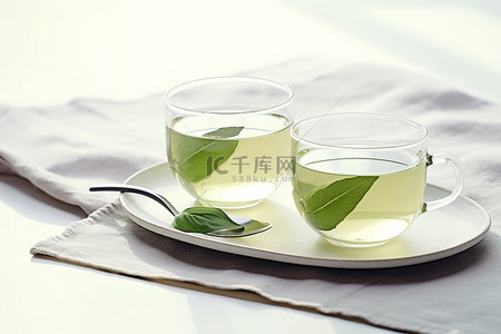 茶叶子背景图片_两杯绿茶和一勺叶子