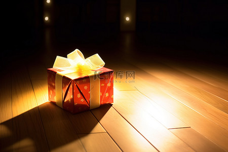 红色礼物圣诞节背景图片_一件红色礼物坐在木地板上