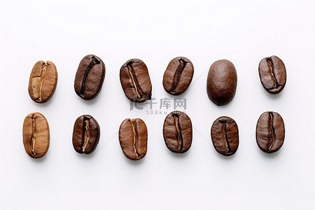 咖啡豆背景图片_乔乔的咖啡豆排列在白色背景上