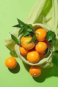 冬天水果背景图片_绿色背景袋中的新鲜柑橘 500px pxpnrsprf3890659009