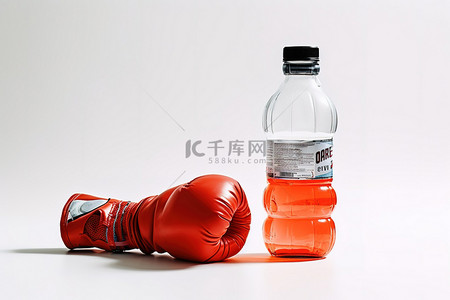 拳击手套背景图片_水瓶和拳击手套坐在白色的白色桌子上