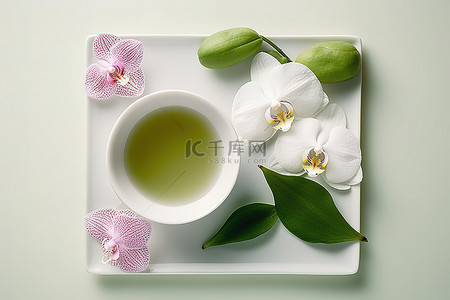 热背景图片_碗里的热绿茶和白兰花