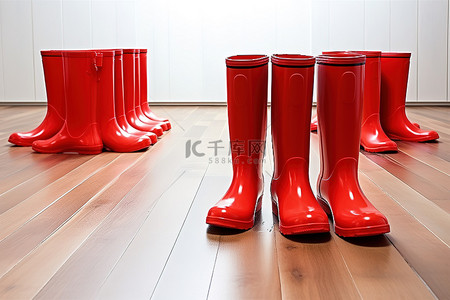 木地板上的红色雨靴