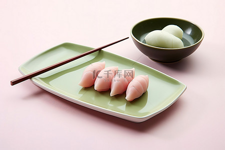 中秋背景图片_用筷子将tasuhizukuro放在盘子上
