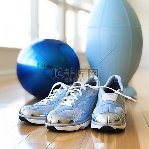 运动鞋背景图片_地板上有一双健身鞋，旁边有一个蓝色的球