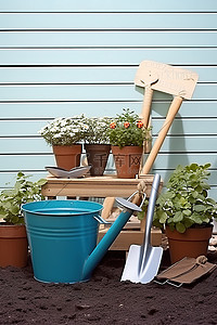 一个小花园长凳，配有水桶铲子和小型园艺工具