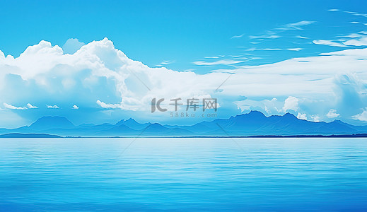 蓝色的海洋背景图片_蓝色的海洋，背景中有一些云彩和山脉