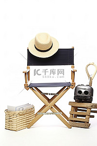 临时演员背景图片_演员办公桌和摄影设备，旁边有一顶带稻草的帽子