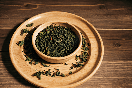 绿茶茶叶摄影照片_盘子里的绿茶茶叶摄影图2
