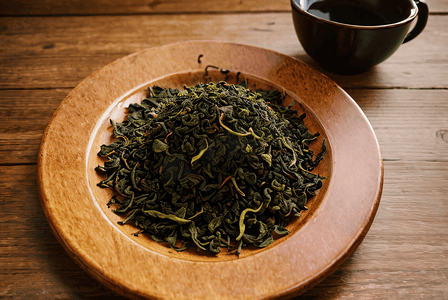 盘子里的绿茶茶叶摄影图4