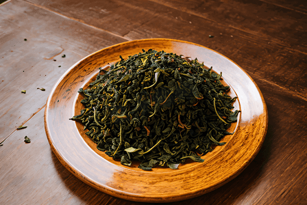 盘子里的绿茶茶叶摄影图6
