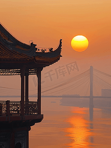 城市高楼黄昏摄影照片_武汉城市风光日落时分的长江大桥黄鹤楼