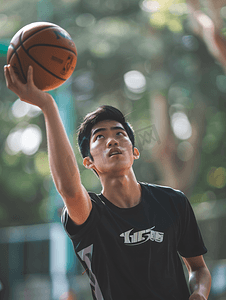 打摄影照片_亚洲人青年男人打篮球