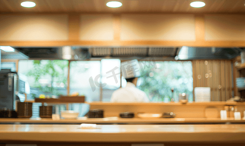 离焦摄影照片_日本餐厅开放式厨房的厨师模糊