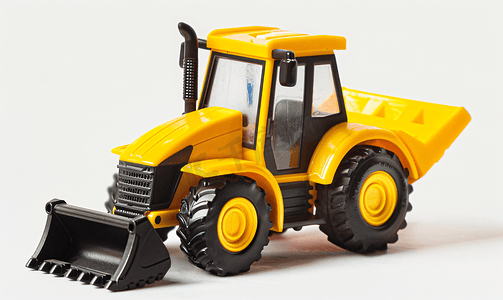 挖挖机摄影照片_白色背景隔离图像上的黄色拖拉机装载机玩具