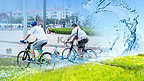 绿色环保健康骑行白天自行车环保城市道路骑行摄影图配图