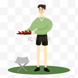 秋游野炊图片_户外烧烤野餐烤香肠的男生