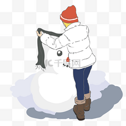 穿羽绒服的女孩给雪人戴围巾