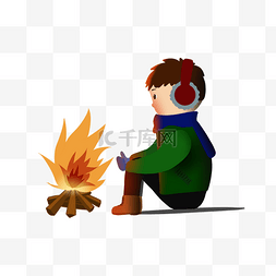 火苗的图片_坐在火堆旁取暖的男孩