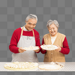 厨房准备年夜饭包饺子的老年夫妻