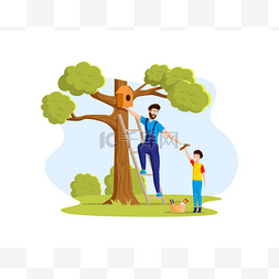 快乐的父亲和儿子把鸟屋挂在树上