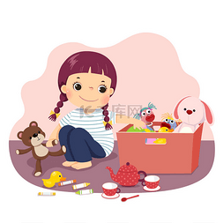 一个小女孩把她的玩具放进盒子里