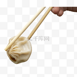 筷子夹小笼包食物