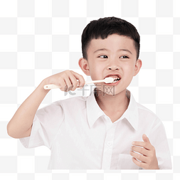 男孩手拿牙刷刷牙
